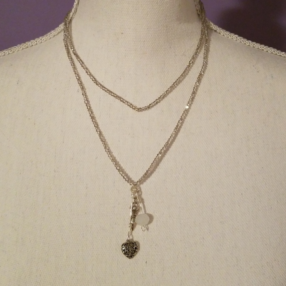 Beaded necklace with three charms